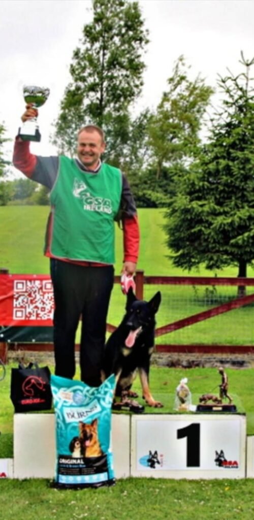 Raymond Simaitis winning first place at the Irish IGP National Championships podium – Houseraydas Dog Training Ireland